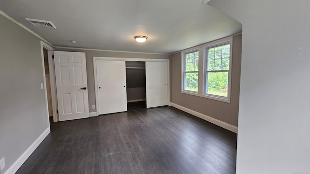 107 N Hollow Rd, Hartland, CT 06027 - unfurnished bedroom with dark wood-style flooring, baseboards, and a closet