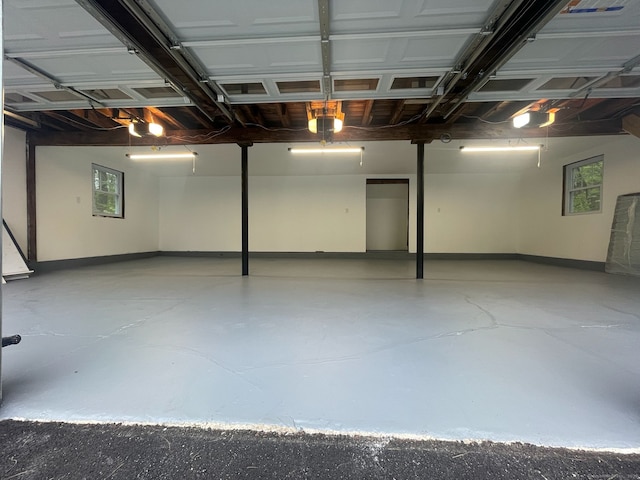 107 N Hollow Rd, Hartland, CT 06027 - garage featuring a garage door opener and baseboards