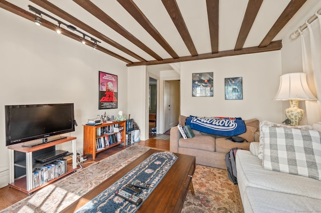 living room featuring hardwood / wood-style flooring and beam ceiling