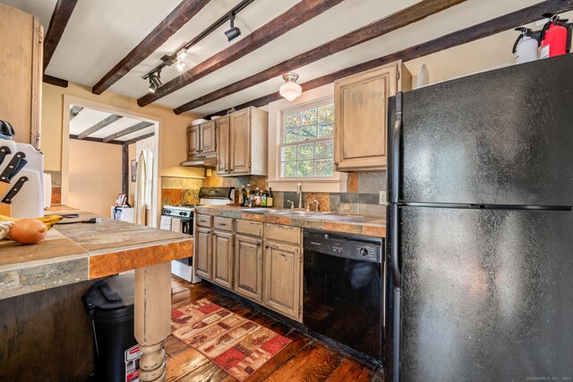 kitchen with dark hardwood / wood-style floors, black appliances, beam ceiling, and tile counters