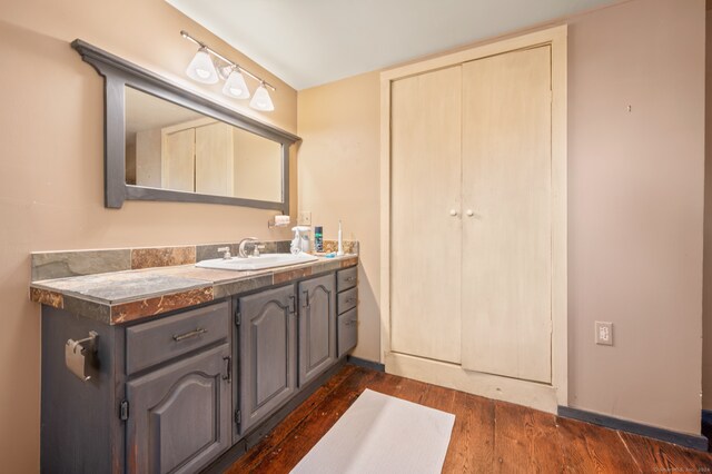 bathroom featuring hardwood / wood-style flooring and vanity