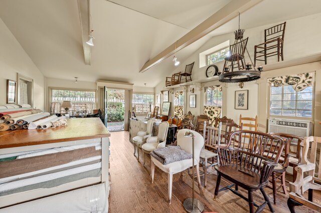 dining area featuring cooling unit, a chandelier, hardwood / wood-style floors, and a wealth of natural light