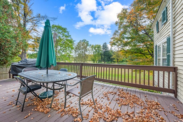 wooden deck with a yard