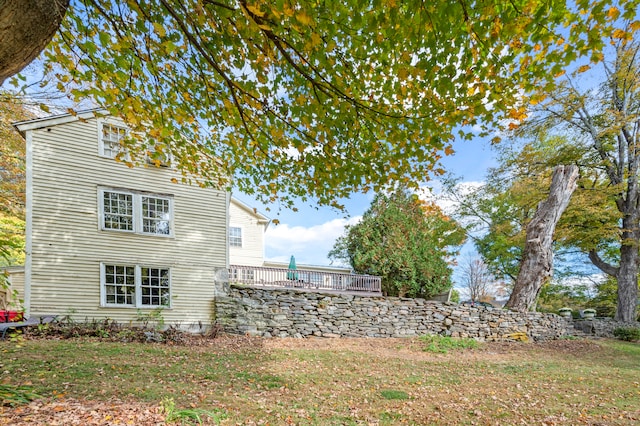 view of yard featuring a wooden deck