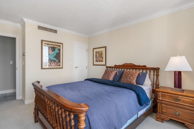 bedroom featuring light colored carpet, a textured ceiling, and ornamental molding