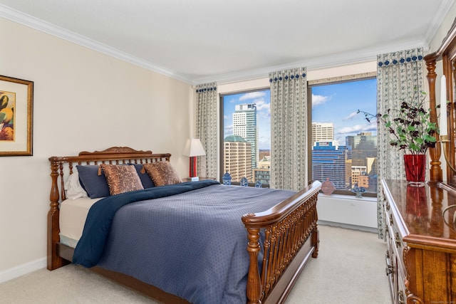 carpeted bedroom with ornamental molding