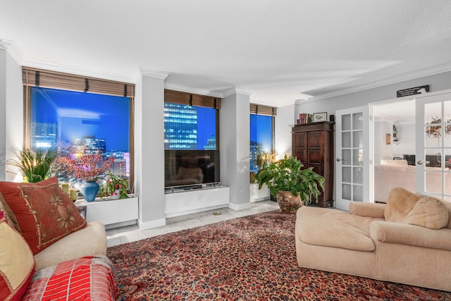 living room featuring tile patterned floors, french doors, and ornamental molding