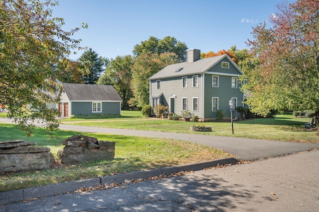 colonial home with a front lawn