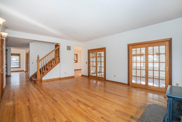 unfurnished living room with hardwood / wood-style floors