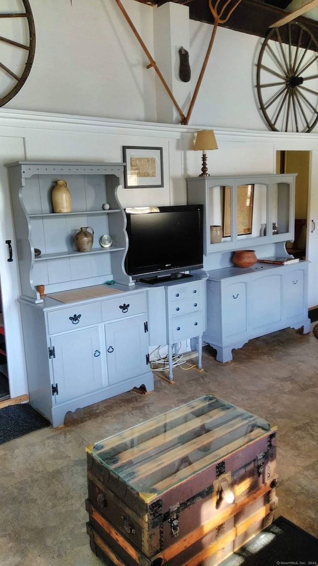 kitchen with light colored carpet and white cabinets