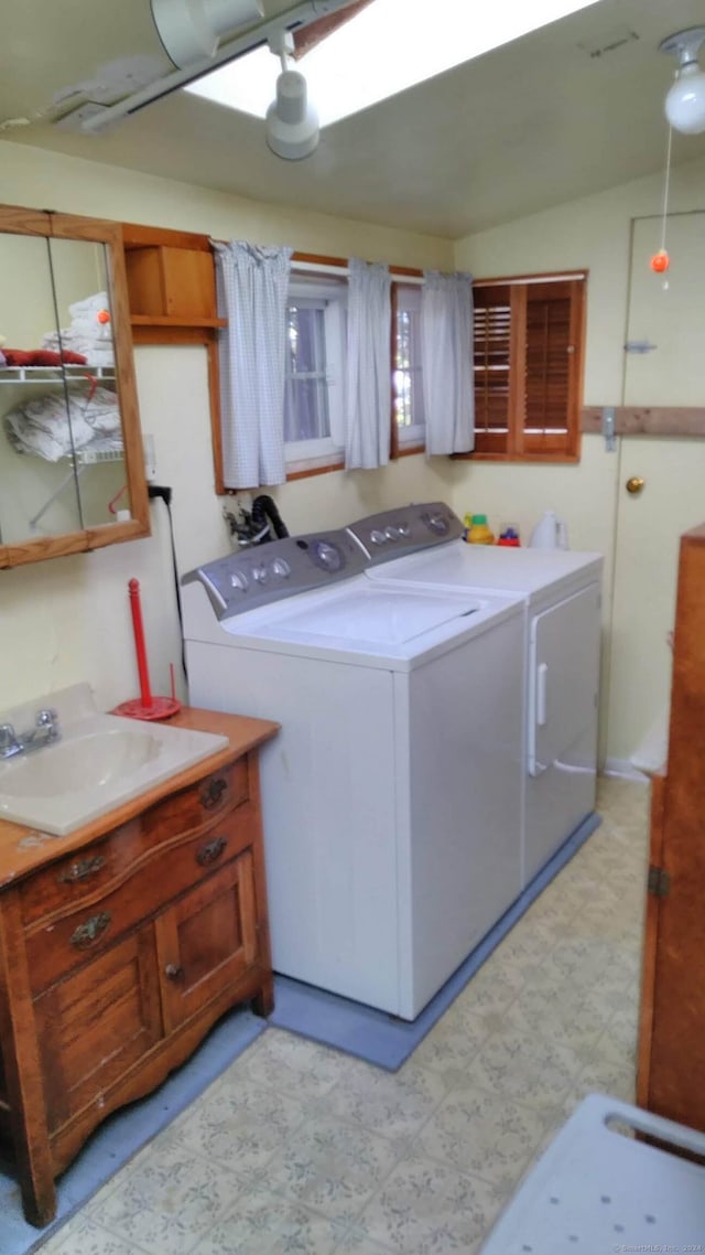 laundry area with sink and washer and dryer