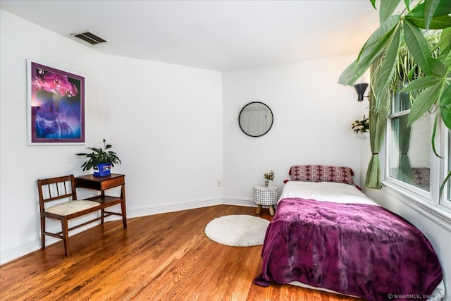 bedroom featuring wood-type flooring