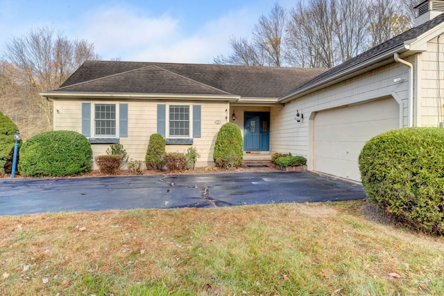 single story home featuring a garage