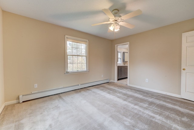 empty room featuring a baseboard radiator, light carpet, and ceiling fan