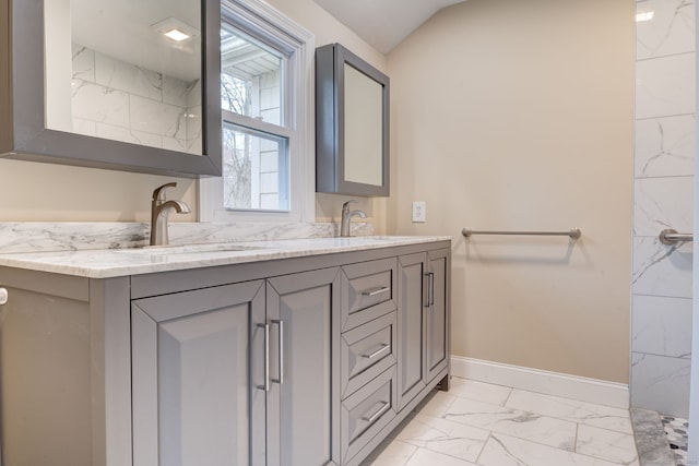 bathroom featuring vanity and vaulted ceiling