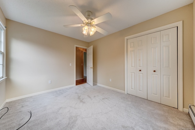 unfurnished bedroom with a closet, ceiling fan, light carpet, and multiple windows