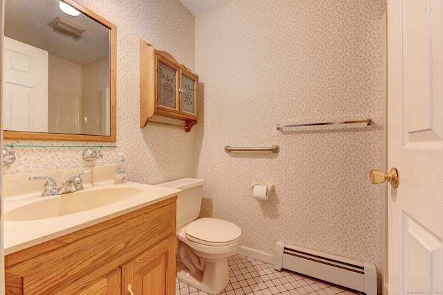 bathroom featuring tile patterned flooring, toilet, baseboard heating, and vanity