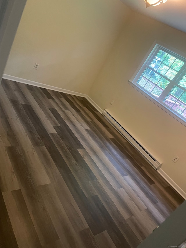 interior details featuring hardwood / wood-style floors and baseboard heating