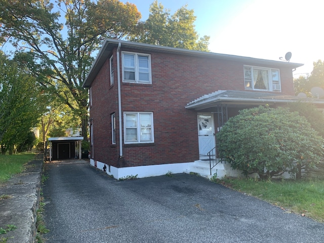 view of front of home featuring a carport