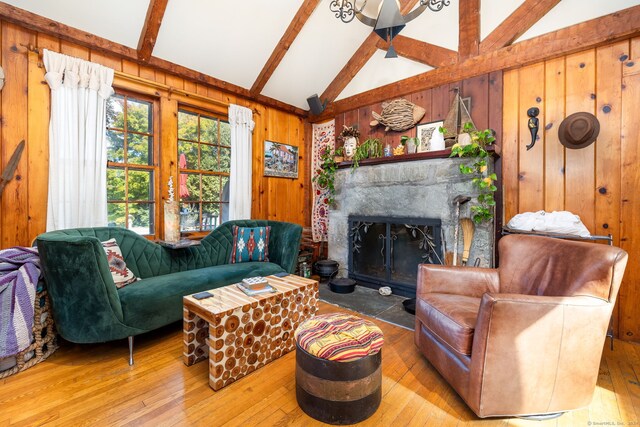 538 Wheelers Pt, Winchester, CT 06098 - living area featuring wood walls, wood-type flooring, and a fireplace with flush hearth