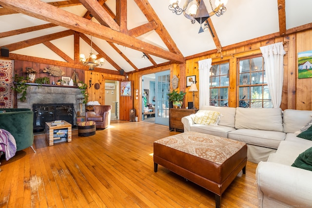 538 Wheelers Pt, Winchester, CT 06098 - living room featuring a chandelier, wood walls, wood-type flooring, beamed ceiling, and high vaulted ceiling