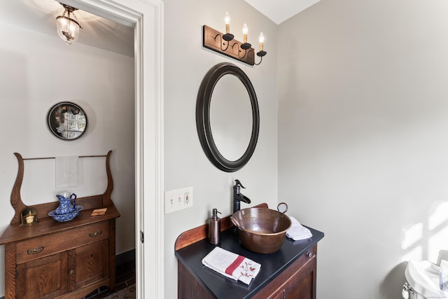 bathroom with baseboards and vanity
