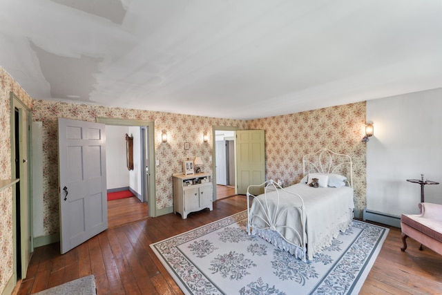 bedroom featuring hardwood / wood-style floors and wallpapered walls