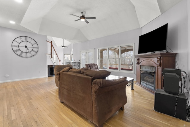 living room with ceiling fan, a healthy amount of sunlight, and light hardwood / wood-style floors