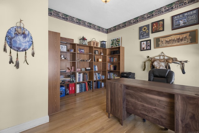 office space with light wood-type flooring