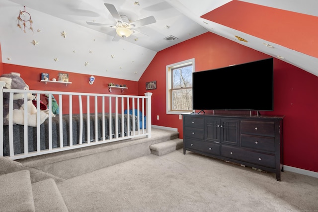 interior space featuring ceiling fan and vaulted ceiling