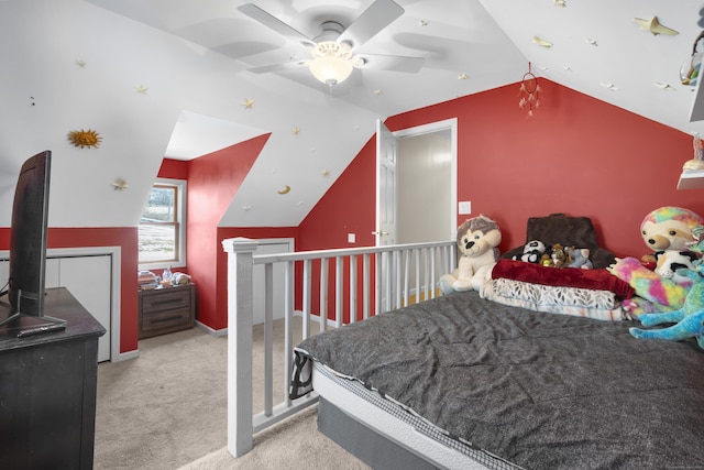 bedroom featuring vaulted ceiling, light colored carpet, and ceiling fan