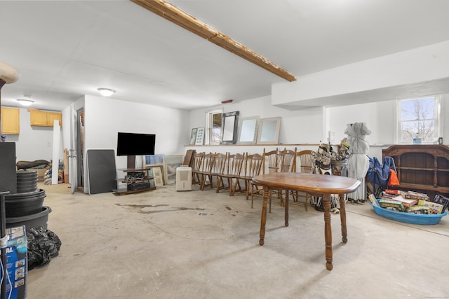 dining space featuring concrete flooring