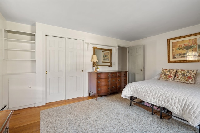 bedroom featuring a closet and hardwood / wood-style flooring