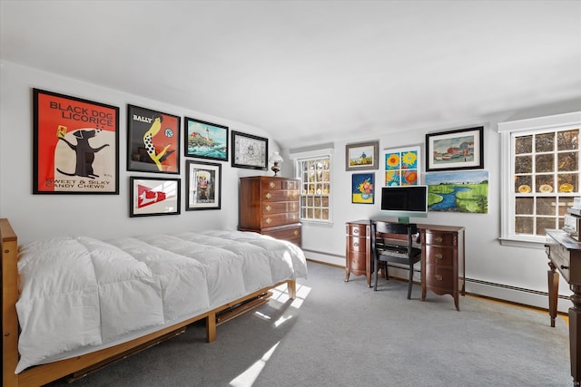 bedroom with lofted ceiling, a baseboard heating unit, and carpet