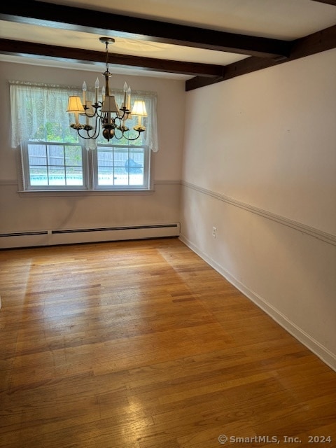 unfurnished dining area with beamed ceiling, a chandelier, a baseboard heating unit, and wood-type flooring