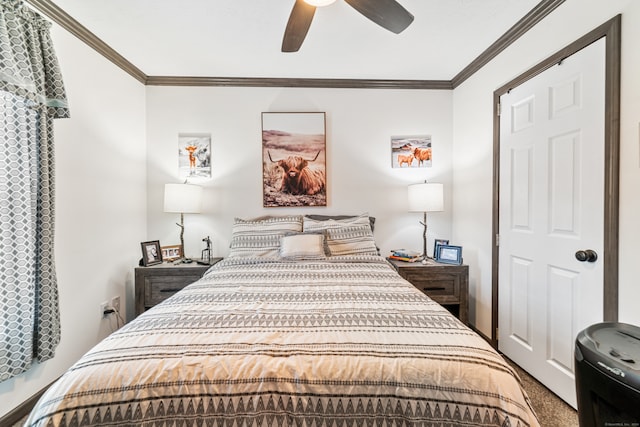 carpeted bedroom with ornamental molding and ceiling fan