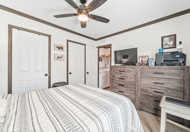 bedroom featuring ceiling fan, ornamental molding, carpet flooring, washer / clothes dryer, and ensuite bathroom