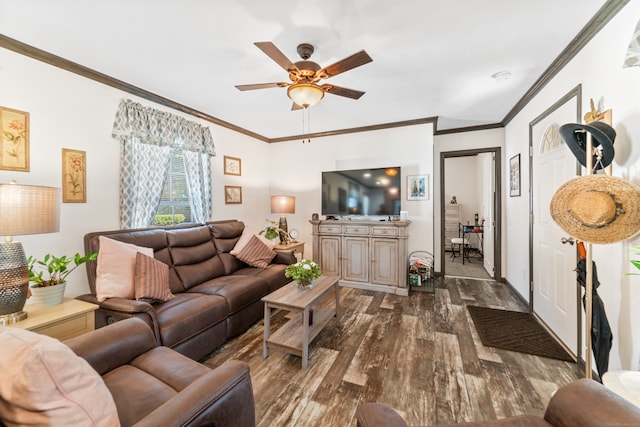 living room featuring ceiling fan, dark hardwood / wood-style floors, and ornamental molding