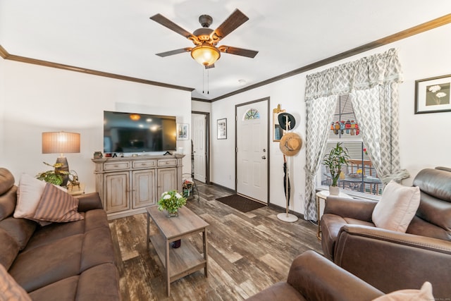 living room with ceiling fan, ornamental molding, and dark wood-type flooring