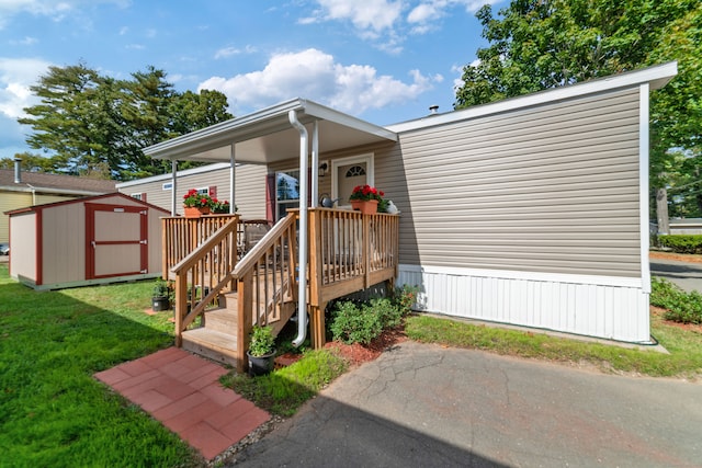 property entrance with a lawn