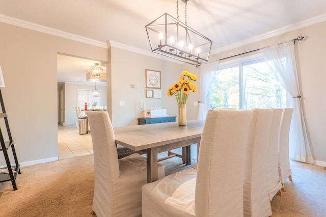 dining space featuring ornamental molding, a chandelier, and light colored carpet