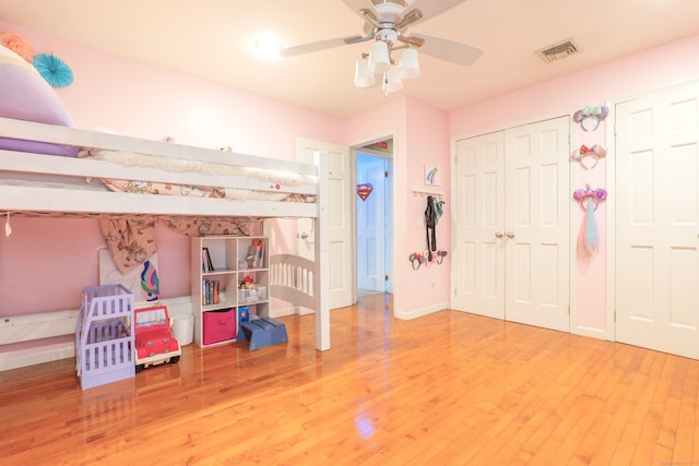 bedroom featuring wood-type flooring and ceiling fan