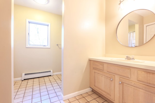 bathroom with vanity, baseboard heating, and tile patterned floors