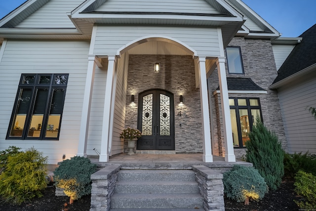 doorway to property featuring french doors