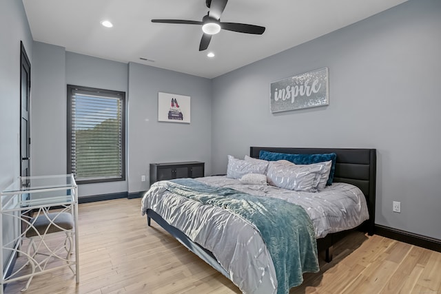 bedroom featuring ceiling fan and light hardwood / wood-style floors