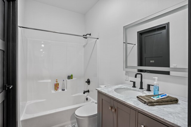 full bathroom with shower / tub combination, vanity, and toilet