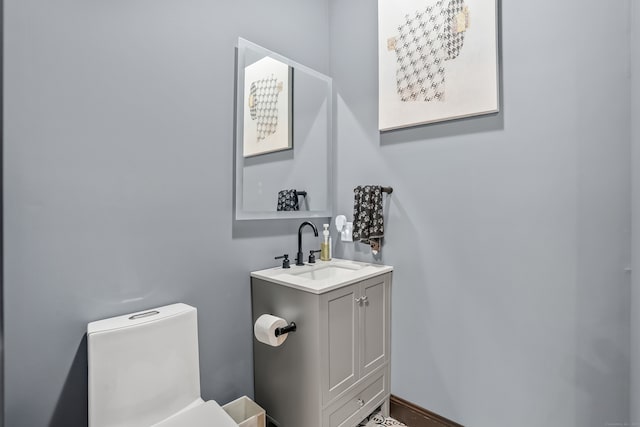 bathroom with vanity and toilet