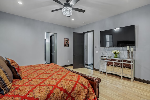 bedroom with light hardwood / wood-style flooring and ceiling fan