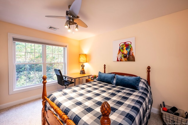 bedroom with ceiling fan and carpet