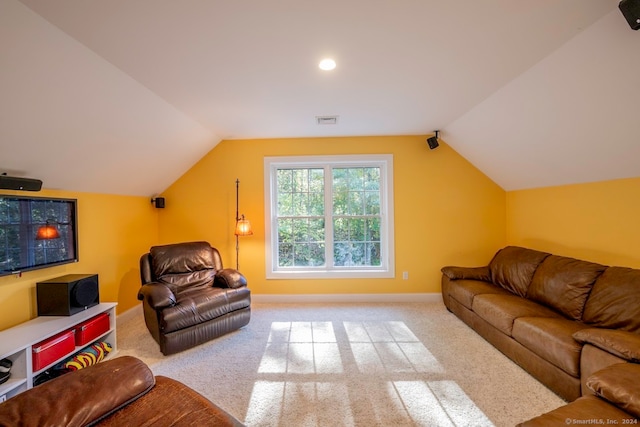 living room with lofted ceiling and carpet floors